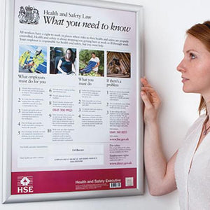 Women looking at Health and Safety Sign