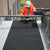 Heavy-duty rubber duckboard mat installed as a safe walkway on a flat commercial roof