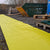 SiteMat Yellow Matting in use in a construction yard